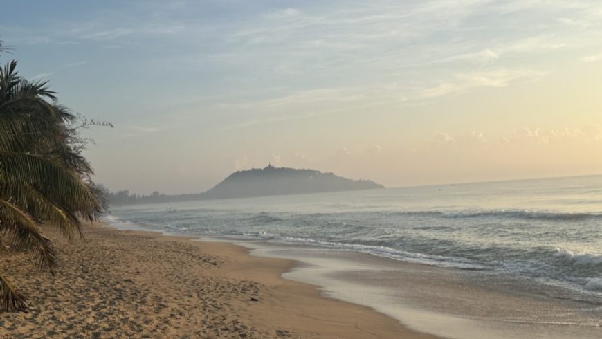 the temple headland in evening light, seen from the beach