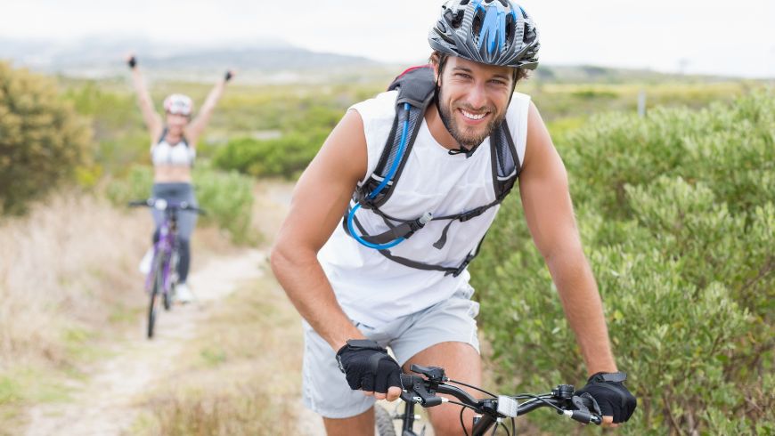 Cyclist riding to a nearby attraction along a scenic path