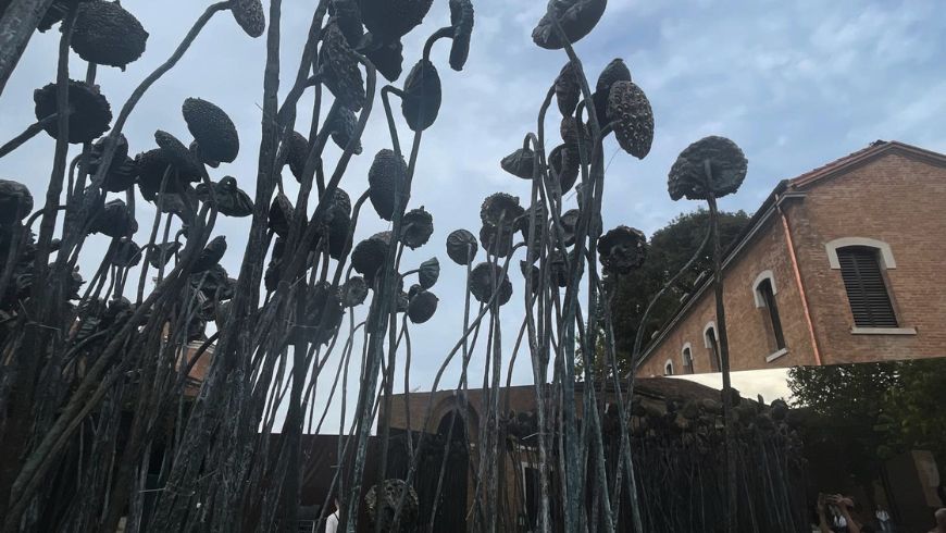 Symbiosis (2026), a garden of bronze sunflowers and mirrors at the 2026 Art Biennale, by artist Xu Jiang