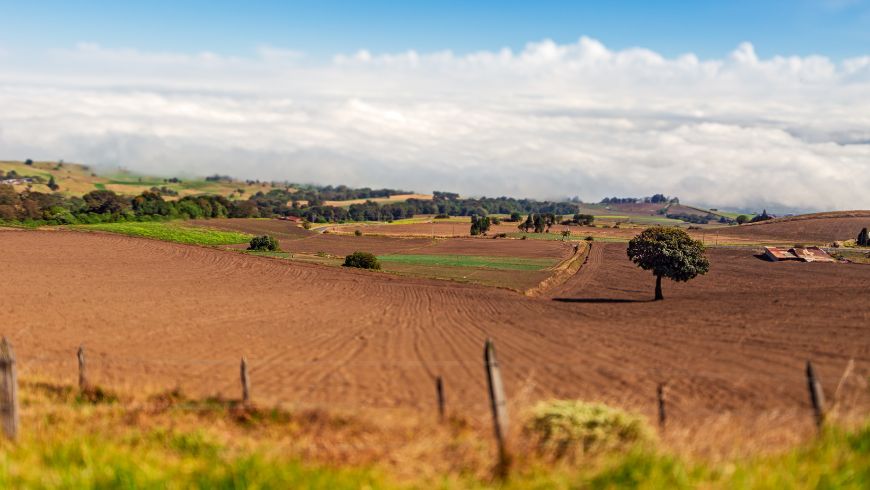 Rural landscape with green fields and rolling hills in Cartago, Costa Rica.
