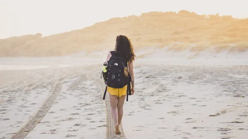 traveller walking on a beach